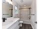 Stylish bathroom boasts modern fixtures, vanity, and a shower-tub for complete relaxation at 5306 Lee Massey Rd, Waxhaw, NC 28173