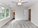 Comfortable bedroom with a ceiling fan, bright window, and access to an attached bath at 5306 Lee Massey Rd, Waxhaw, NC 28173