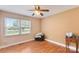 Well-lit bedroom featuring hardwood floors, two windows for natural light, and neutral walls at 5563 Grace Chapel Rd, Hickory, NC 28601