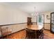 Charming dining room with wood floors, chandelier and natural light at 5563 Grace Chapel Rd, Hickory, NC 28601