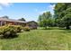 Well maintained front yard with decorative bushes and green grass at 5563 Grace Chapel Rd, Hickory, NC 28601