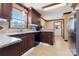 Kitchen with custom wood cabinets, tile backsplash, granite counters, and stainless steel appliances at 5563 Grace Chapel Rd, Hickory, NC 28601