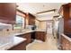 Kitchen featuring custom cabinets, tile backsplash, granite counters, and stainless steel appliances at 5563 Grace Chapel Rd, Hickory, NC 28601