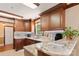 Well-lit kitchen boasts custom wood cabinets, granite countertops, and updated appliances at 5563 Grace Chapel Rd, Hickory, NC 28601