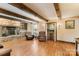 Cozy living room with stone fireplace, hardwood floors and custom bar area at 5563 Grace Chapel Rd, Hickory, NC 28601