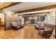 Spacious living room features wood beams, stone fireplace and hardwood floors at 5563 Grace Chapel Rd, Hickory, NC 28601