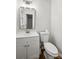 Bright bathroom with a white vanity, modern mirror and a toilet at 613 Davis St, Lancaster, SC 29720