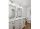 Bright bathroom featuring a double vanity, stylish mirrors and modern fixtures at 613 Davis St, Lancaster, SC 29720