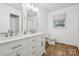 Beautiful bathroom with double vanity, marble countertops, and modern fixtures at 613 Davis St, Lancaster, SC 29720