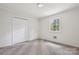 A quaint bedroom with closet and a bright window at 613 Davis St, Lancaster, SC 29720