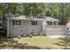 Charming home featuring a quaint front porch and gray exterior paint at 613 Davis St, Lancaster, SC 29720
