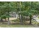 Exterior of home surrounded by lush green trees at 613 Davis St, Lancaster, SC 29720