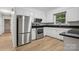 Updated kitchen featuring stainless steel appliances, modern countertops, and white cabinets at 613 Davis St, Lancaster, SC 29720