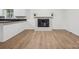 Open concept living room featuring fireplace and hardwood flooring at 613 Davis St, Lancaster, SC 29720