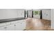 Open-concept living room featuring hardwood floors and natural light from a large window at 613 Davis St, Lancaster, SC 29720
