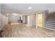 Open basement area with neutral walls, modern flooring, and ample space for recreation at 6150 Rocky Falls Rd, Charlotte, NC 28211