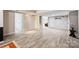 Basement with neutral walls, light flooring, multiple entrances, and a finished space at 6150 Rocky Falls Rd, Charlotte, NC 28211