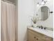 Clean bathroom featuring a vanity with marble top and shower with white curtain at 6150 Rocky Falls Rd, Charlotte, NC 28211