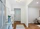 Bright entryway showcasing hardwood floors, stylish console table, and neutral decor at 6150 Rocky Falls Rd, Charlotte, NC 28211