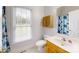 Bright bathroom with natural lighting and a floral shower curtain at 6825 Woodleaf Rd, Woodleaf, NC 27054
