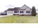 Well maintained one story home with a two car garage and manicured lawn at 6825 Woodleaf Rd, Woodleaf, NC 27054