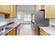 Bright kitchen featuring stainless steel appliances and wooden cabinets at 6825 Woodleaf Rd, Woodleaf, NC 27054