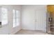 Bright eat-in kitchen featuring tile flooring, neutral walls, and stainless appliances at 6825 Woodleaf Rd, Woodleaf, NC 27054