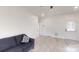 Cozy living room with laminate floors and blue couch near the entrance at 6825 Woodleaf Rd, Woodleaf, NC 27054