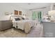 Bright bedroom featuring a walkout balcony and a decorative carpet at 6934 Loretta Pl, Charlotte, NC 28215