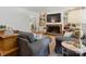 Cozy living room featuring a fireplace, built-in bookshelves, and comfortable seating at 6934 Loretta Pl, Charlotte, NC 28215
