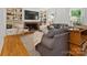 Cozy living room featuring a fireplace, built-in bookshelves, and comfortable seating at 6934 Loretta Pl, Charlotte, NC 28215
