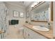 Well-maintained, neutral bathroom with ample storage and decorative mirror at 7026 Tabor Ln, Charlotte, NC 28211