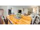 Spacious dining area with a large wooden table, perfect for entertaining, connecting to both living and kitchen areas at 7026 Tabor Ln, Charlotte, NC 28211