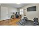 A well-lit flex space featuring a home gym and a computer setup at 7026 Tabor Ln, Charlotte, NC 28211