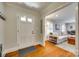 Welcoming foyer with hardwood floors that lead into a bright living space with a comfortable sofa at 7026 Tabor Ln, Charlotte, NC 28211