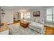 Stylish living room with a sectional, wooden trunk coffee table, and bright decor for comfortable everyday living at 7026 Tabor Ln, Charlotte, NC 28211