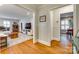 Spacious living room with hardwood floors, an open layout, and plenty of natural light streaming in from windows at 7026 Tabor Ln, Charlotte, NC 28211