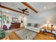 Inviting living area featuring exposed wood beams and an open layout perfect for entertaining at 7026 Tabor Ln, Charlotte, NC 28211