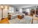 Comfortable living room with a large sectional sofa, stylish rug, and elegant decor for a relaxing atmosphere at 7026 Tabor Ln, Charlotte, NC 28211
