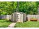Storage shed with double doors and a pea gravel sidewalk at 7026 Tabor Ln, Charlotte, NC 28211
