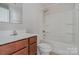 Bathroom features a tub with shower, a single sink vanity, and a standard toilet at 706 Dillon Way, Fort Mill, SC 29715