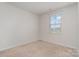 Empty bedroom featuring carpet flooring, neutral paint and a window at 706 Dillon Way, Fort Mill, SC 29715