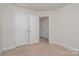 Bedroom with carpet flooring, neutral paint and closet with double doors at 706 Dillon Way, Fort Mill, SC 29715