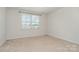 Bedroom with neutral walls, carpet flooring and a window for natural light at 706 Dillon Way, Fort Mill, SC 29715