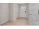 Entryway with tile flooring, a white front door with glass panes, and a neutral wall color at 706 Dillon Way, Fort Mill, SC 29715