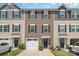 Townhome exterior with neutral siding, black shutters, a one-car garage, and well-maintained landscaping at 706 Dillon Way, Fort Mill, SC 29715