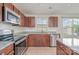 Well-lit kitchen with stainless steel appliances, granite countertops and stylish tile backsplash at 706 Dillon Way, Fort Mill, SC 29715