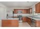 Kitchen with stainless steel appliances, granite countertops, an island, and tile backsplash at 706 Dillon Way, Fort Mill, SC 29715