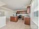 Kitchen with stainless steel appliances, a center island, granite countertops, and tile flooring at 706 Dillon Way, Fort Mill, SC 29715
