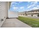 Exterior view of a private patio in a neighborhood with grassy areas and townhomes at 706 Dillon Way, Fort Mill, SC 29715
